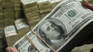 NBK: الدولار القوي يدعم توقعات رفع أسعار الفائدة