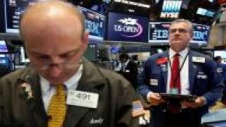 الأسهم الأمريكية تغلق على انخفاض طفيف